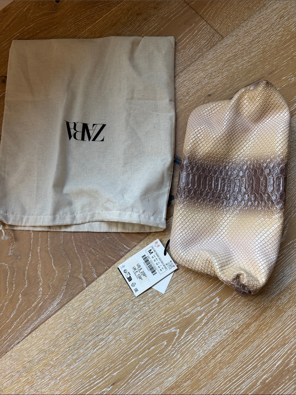 Zara Shimmery Snake-Effect Clutch in Gold and Brown
